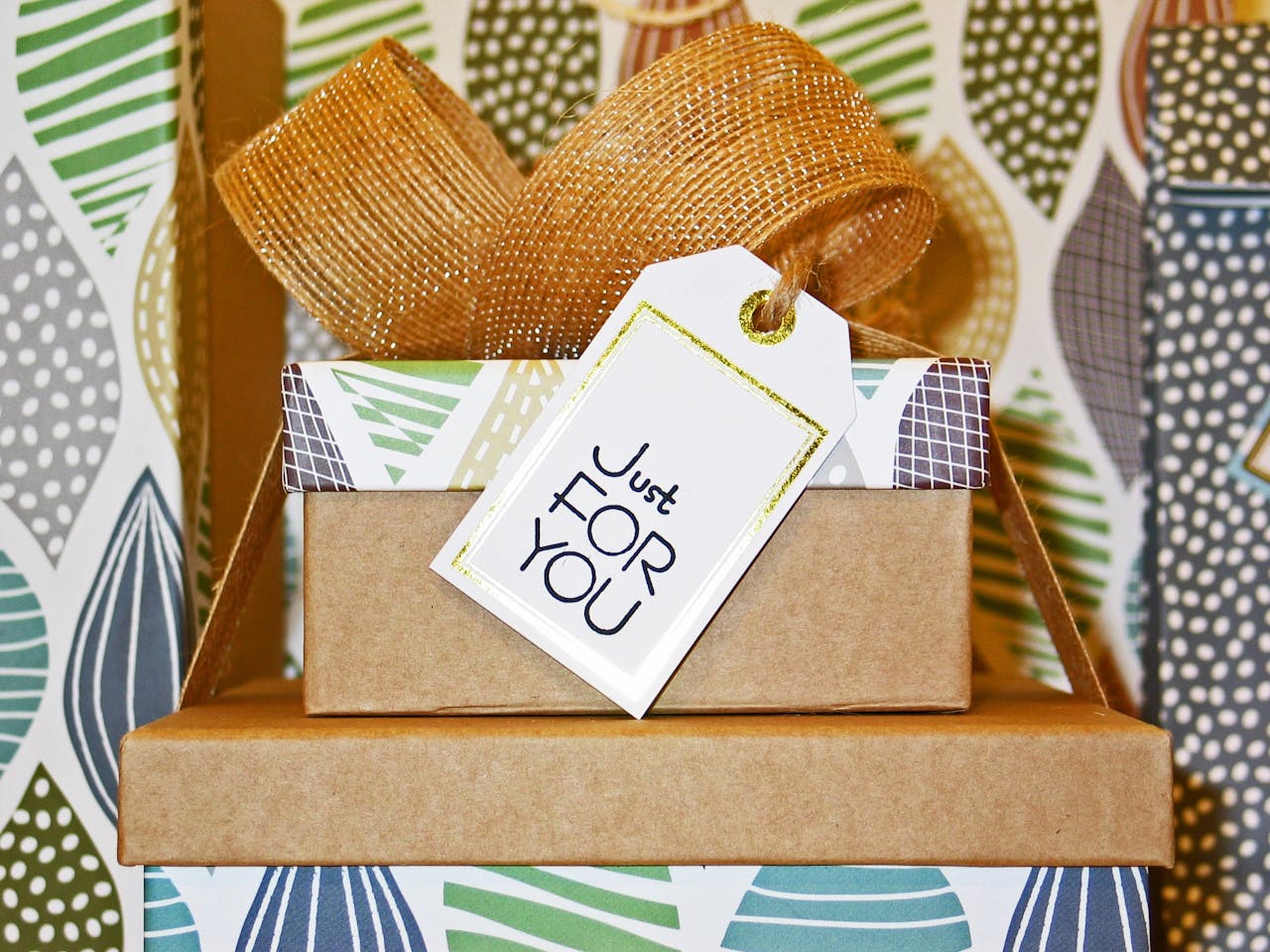 A neatly wrapped gift box with decorative ribbon and Just For You tag, perfect for celebrations.